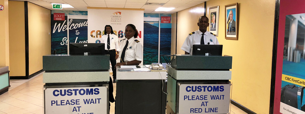 Customs officers at airport counter.
