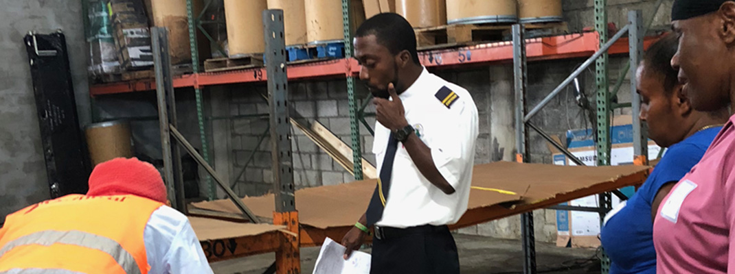 Customs officer examining goods.